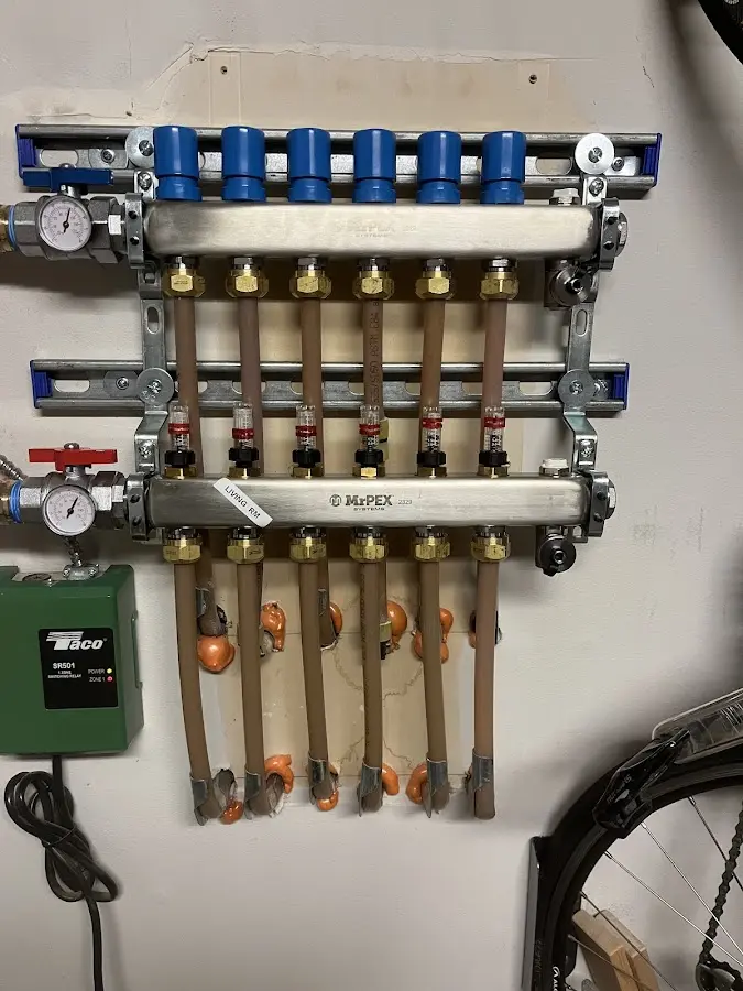 Plumber performing Water Heater Repair at a residential property in Little Canada